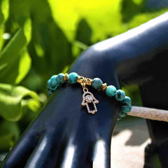 Pulsera con Mano de Fátima (Hamsa) y Flor de Lluvia | Piedras Naturales, Elástica | Joyería Artesanal | Libela Joyería Artesanal Pulsera con Mano de Fátima (Hamsa) y Flor de Lluvia | Piedras Naturales, Elástica | Joyería Artesanal | Libela Joyería Artesanal